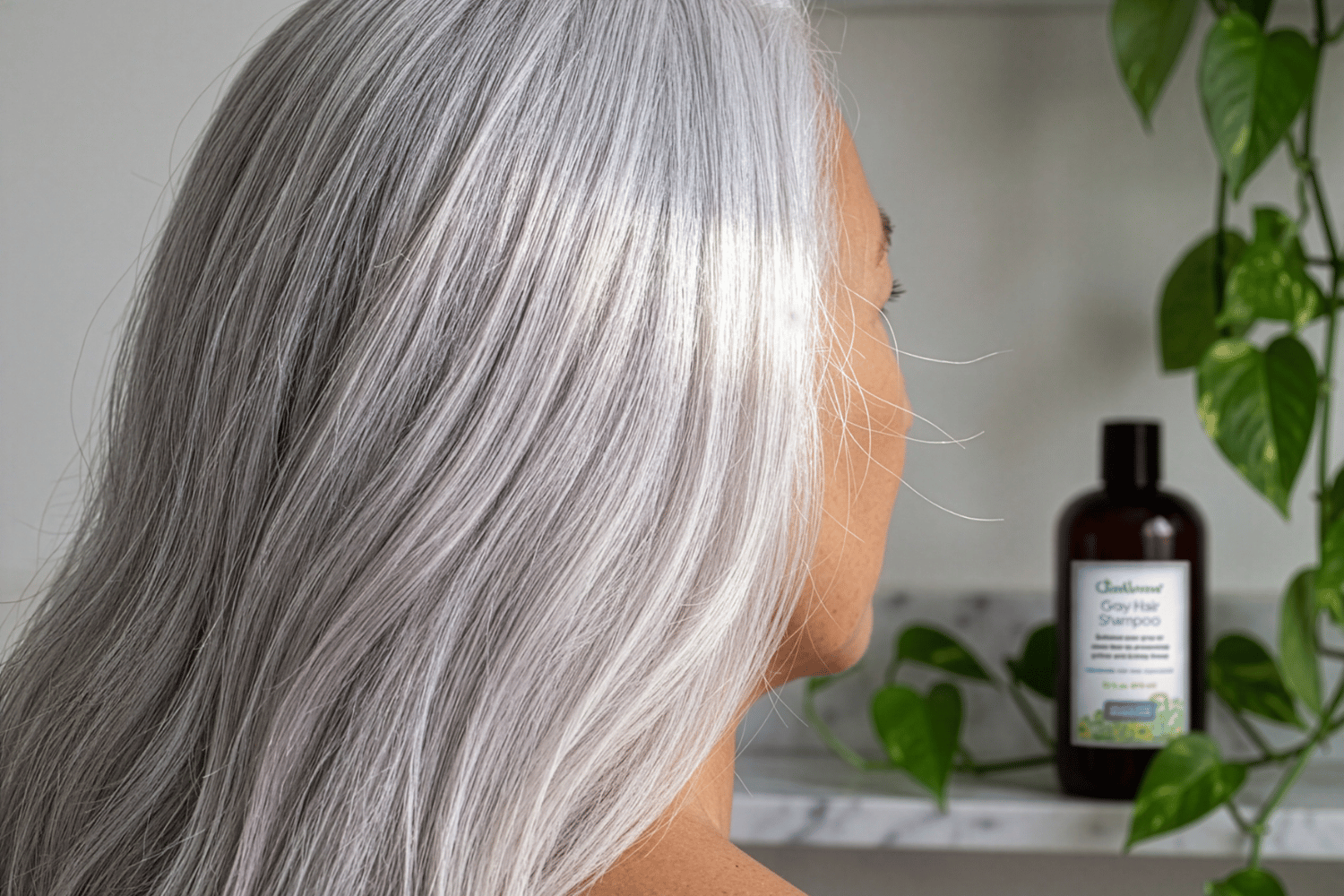 a woman hair blowing in the air with beautiful gray hair