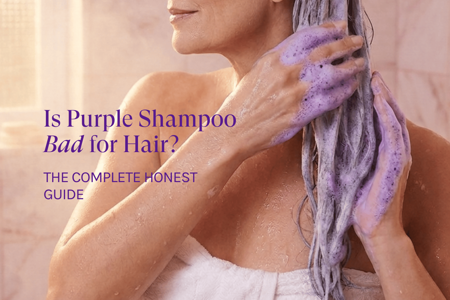 a woman washing her gray hair with purple shampoo