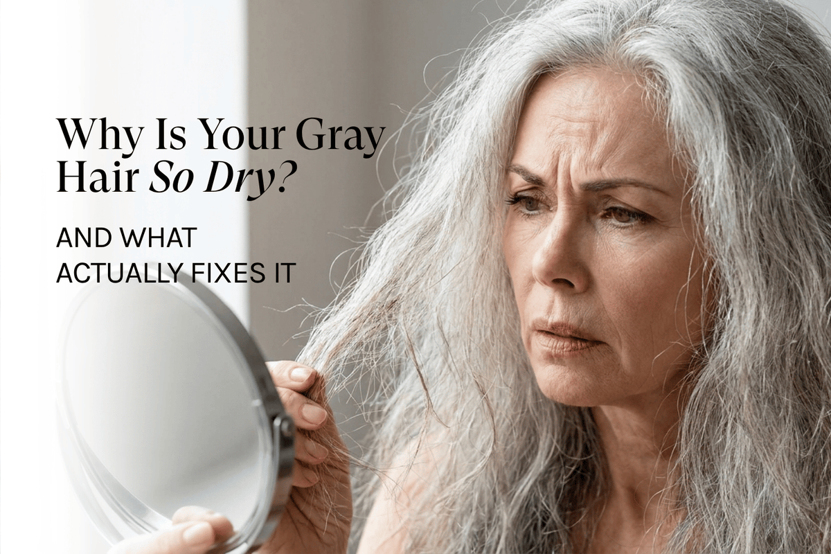 a woman looking in the mirror with dry gray hair
