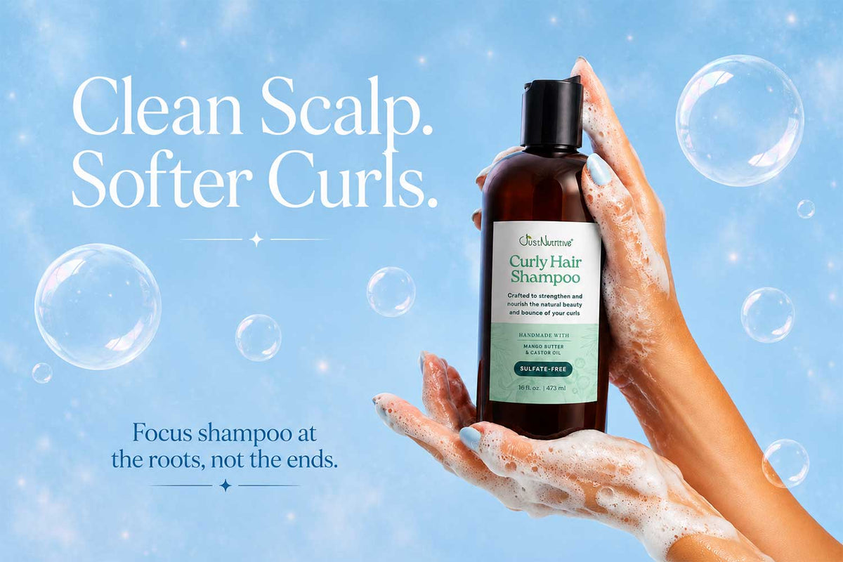 Clean scalp, softer curls: hands holding Just Nutritive Curly Hair Shampoo