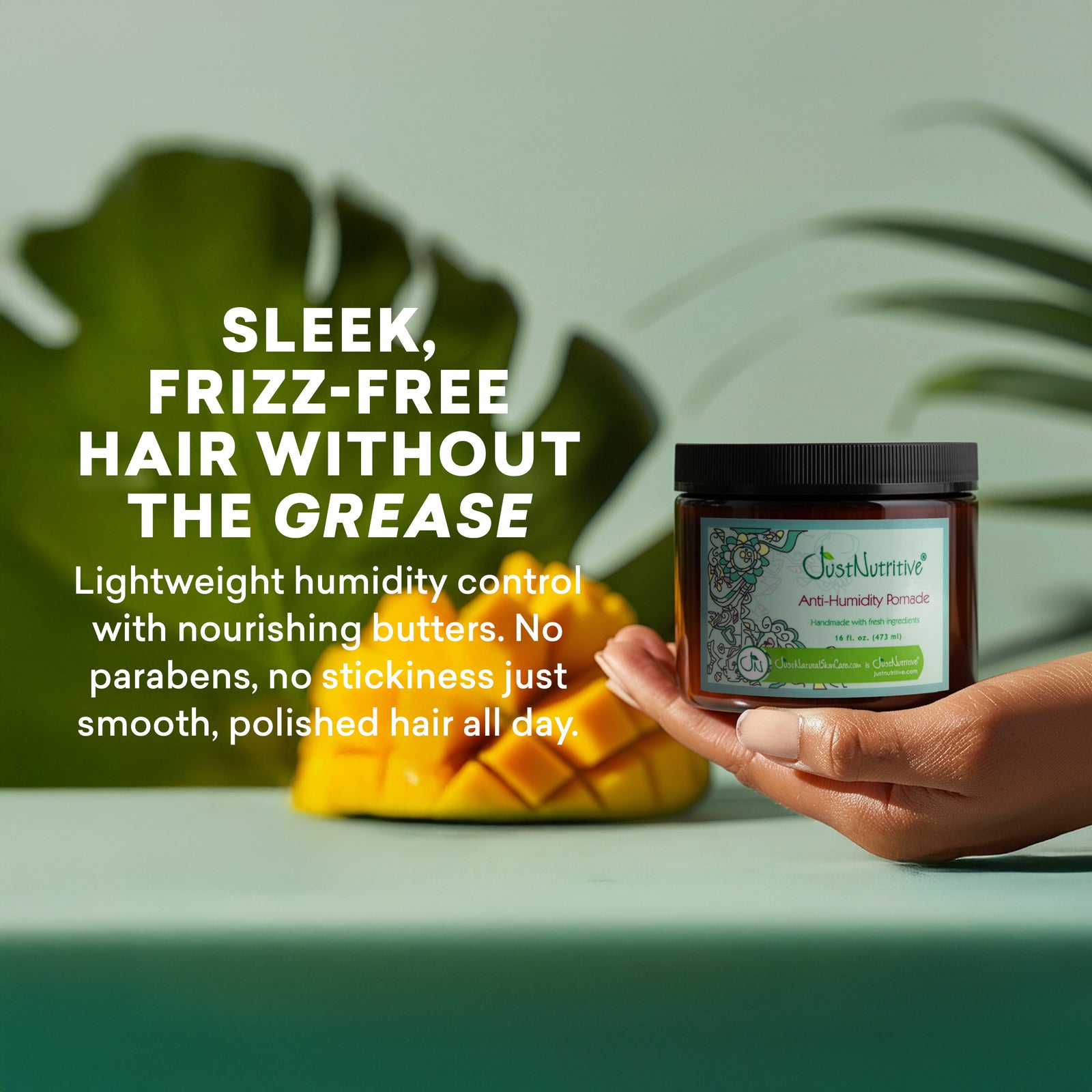 Hand holding a jar of hair care product with text about hair care benefits on a green background