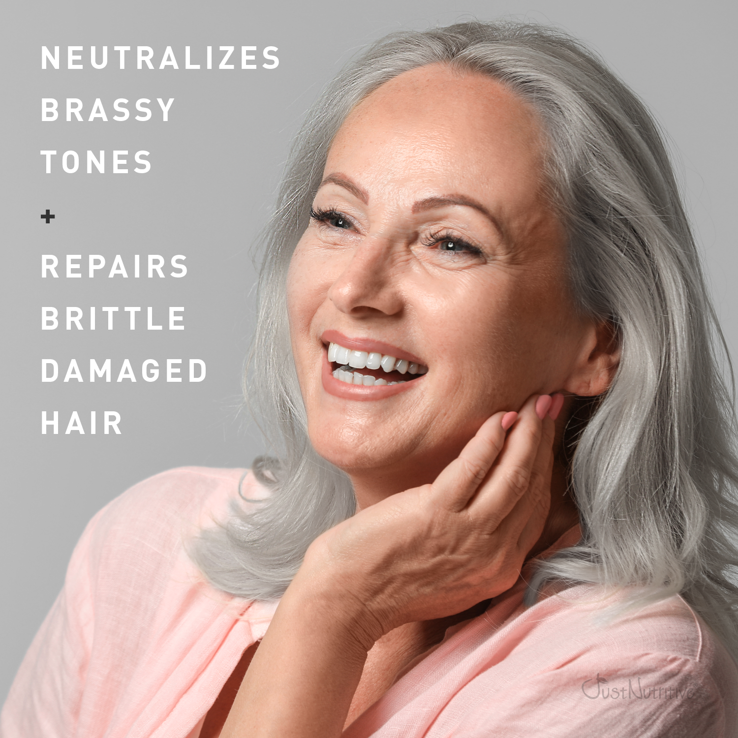 Woman with gray hair touching her neck, with text about hair care products on a gray background
