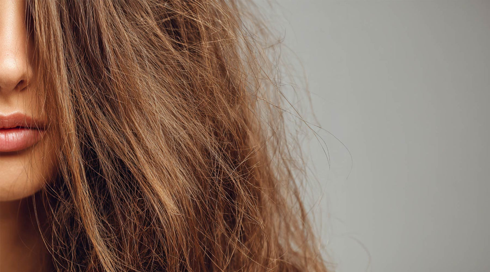 front-view-woman-damaged-hair-gray-background