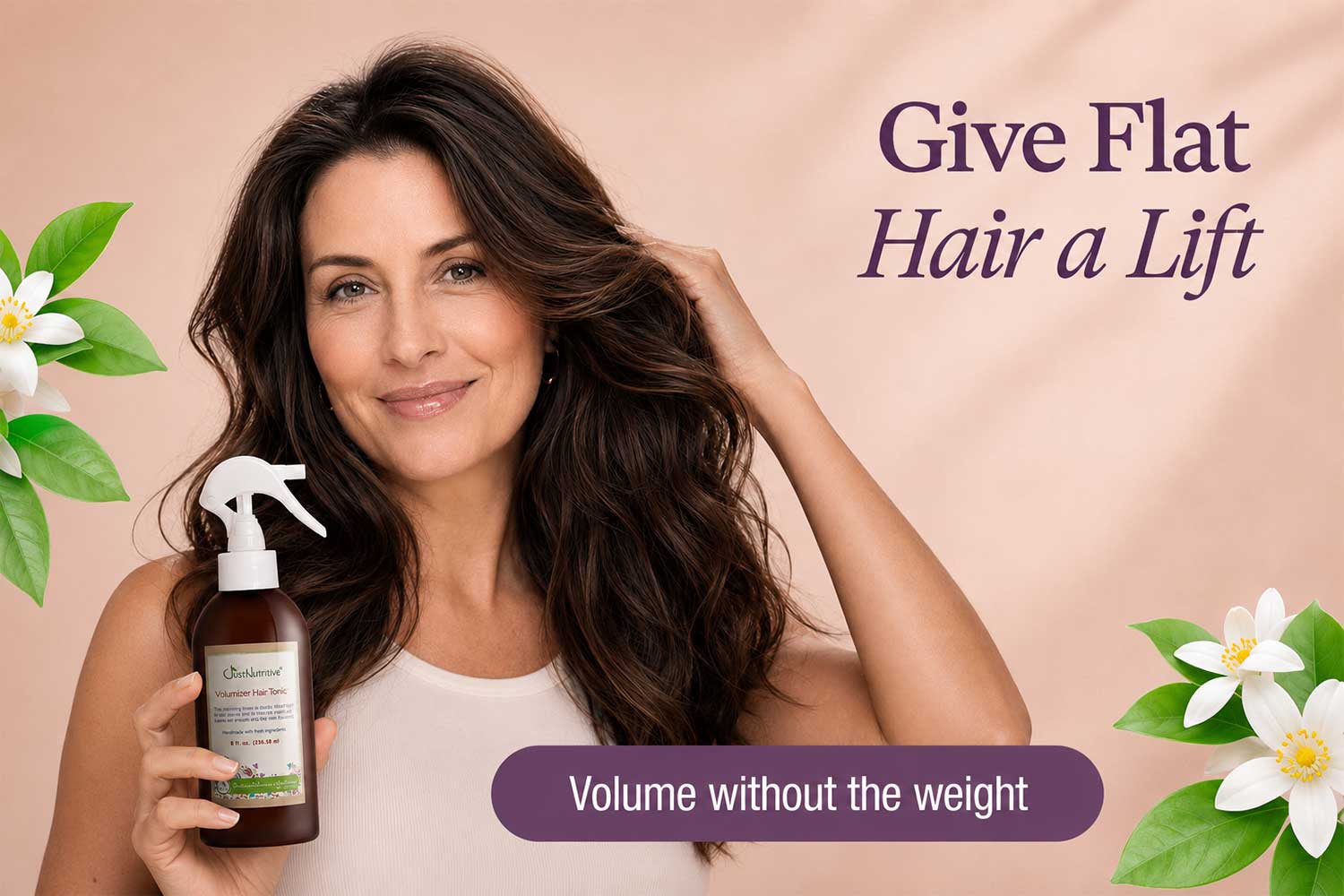 woman-holding-volumizer-hair-tonic-pink-background