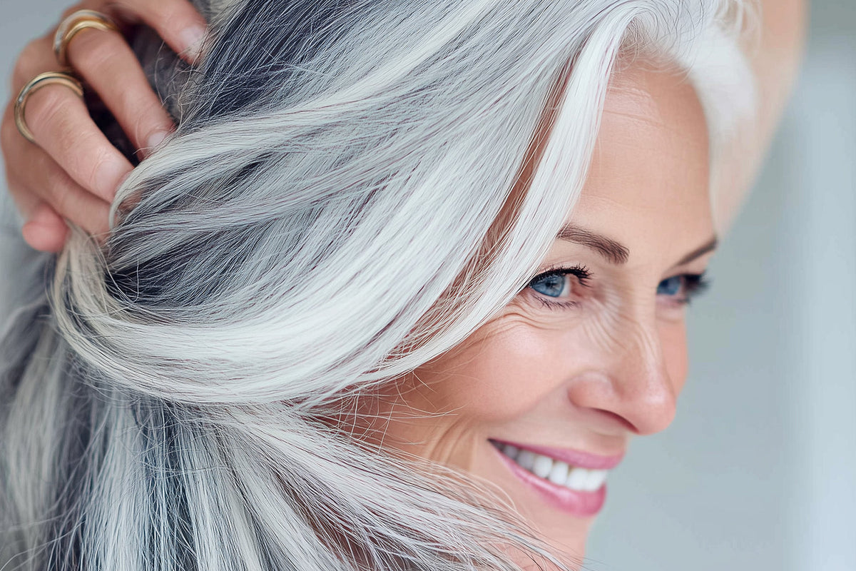 Middle age woman with silky, soft, healthy gray hair