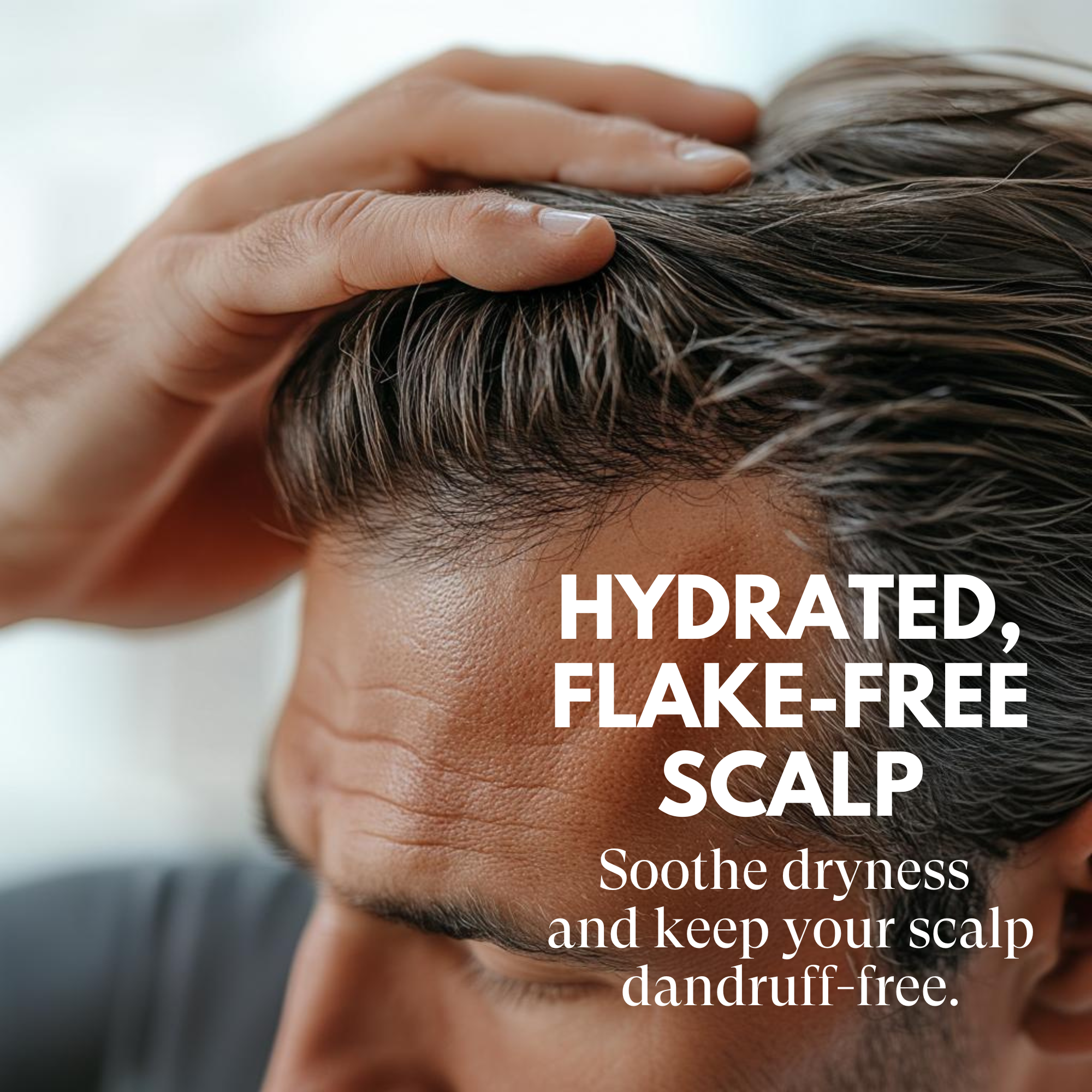 Person touching their scalp with text about hydrated, flake-free scalp