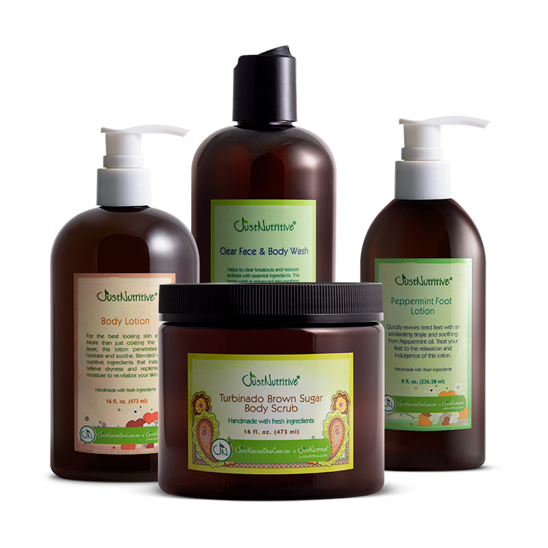 Collection of Just Nutritive skincare products including body lotion, face and body wash, scrub, and foot lotion on a white background.
