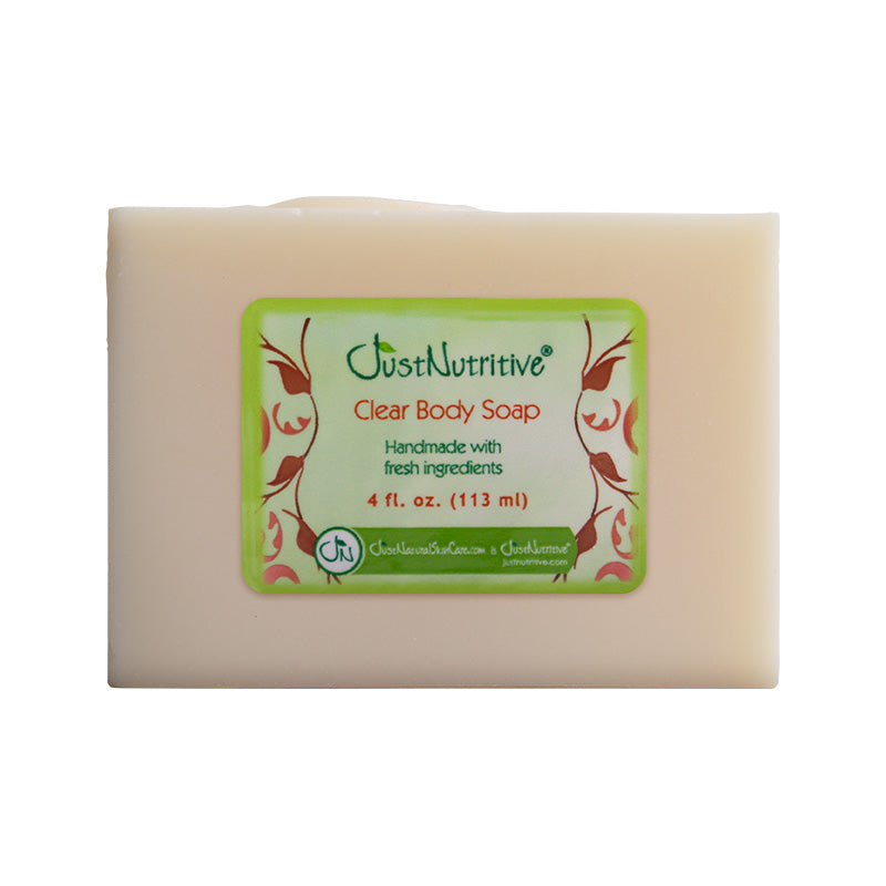 Bar of clear body soap with a green label on a white background