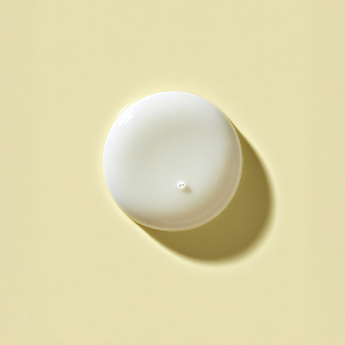 White sphere on a yellow background
