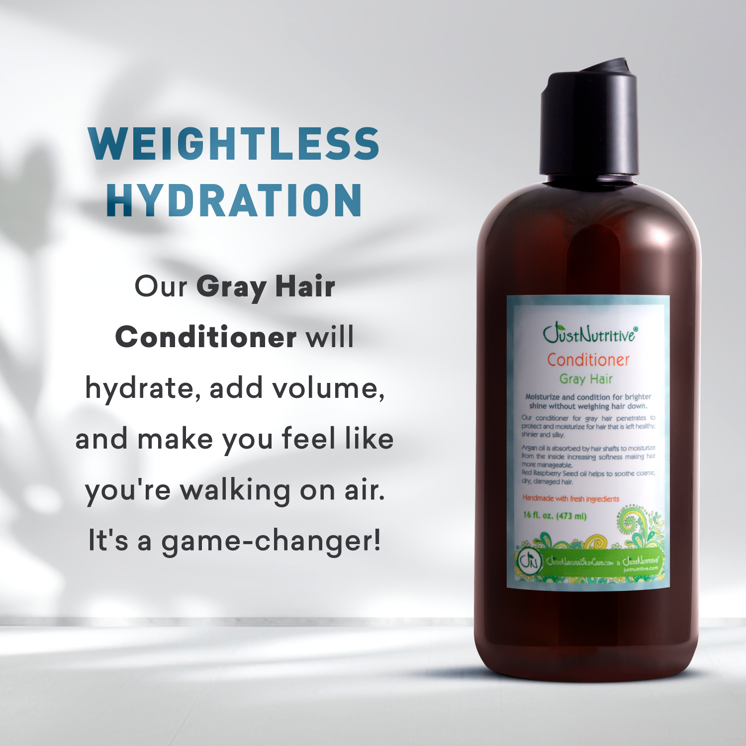 Bottle of gray hair conditioner with text highlighting its benefits on a light background