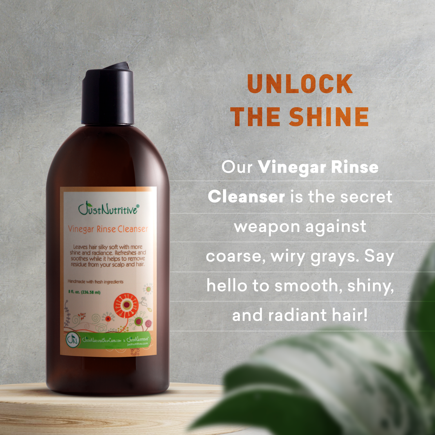 Brown bottle of Just Nutritive Vinegar Rinse Cleanser with text on a gray background