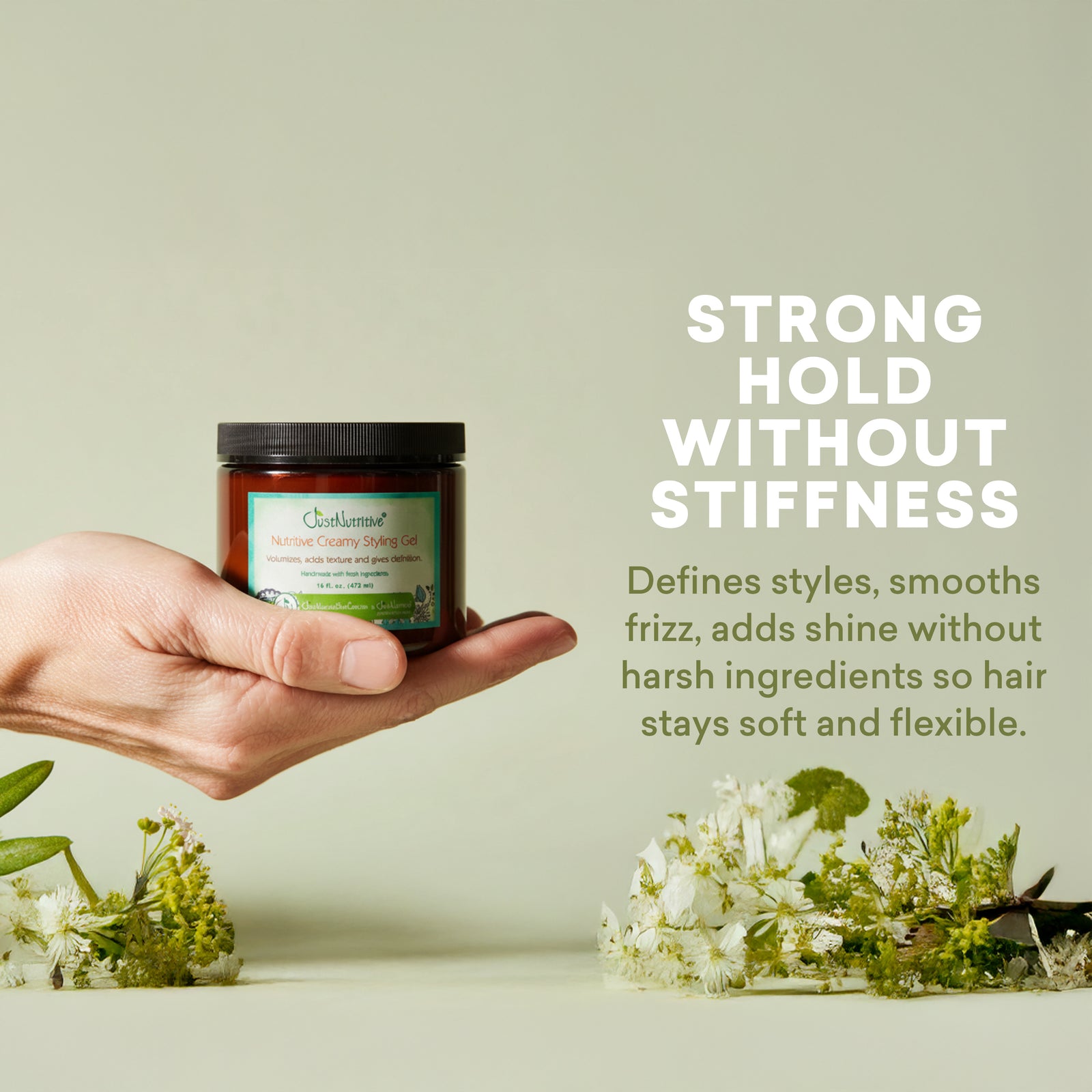 Hand holding a jar of hair product with text about its properties on a light background