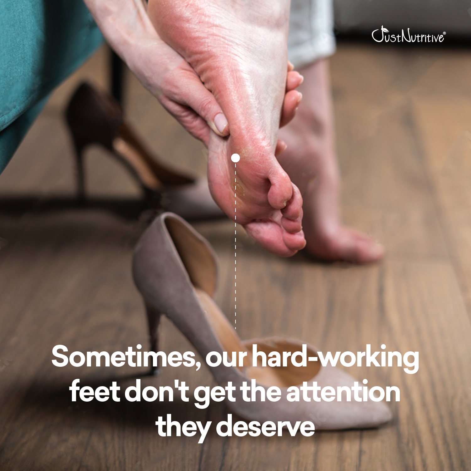 Person checking the foot of another person with high heels on a wooden floor.