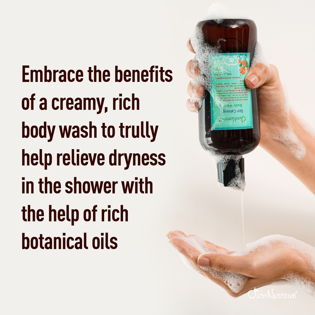 Hand holding a bottle of body wash with text about its benefits