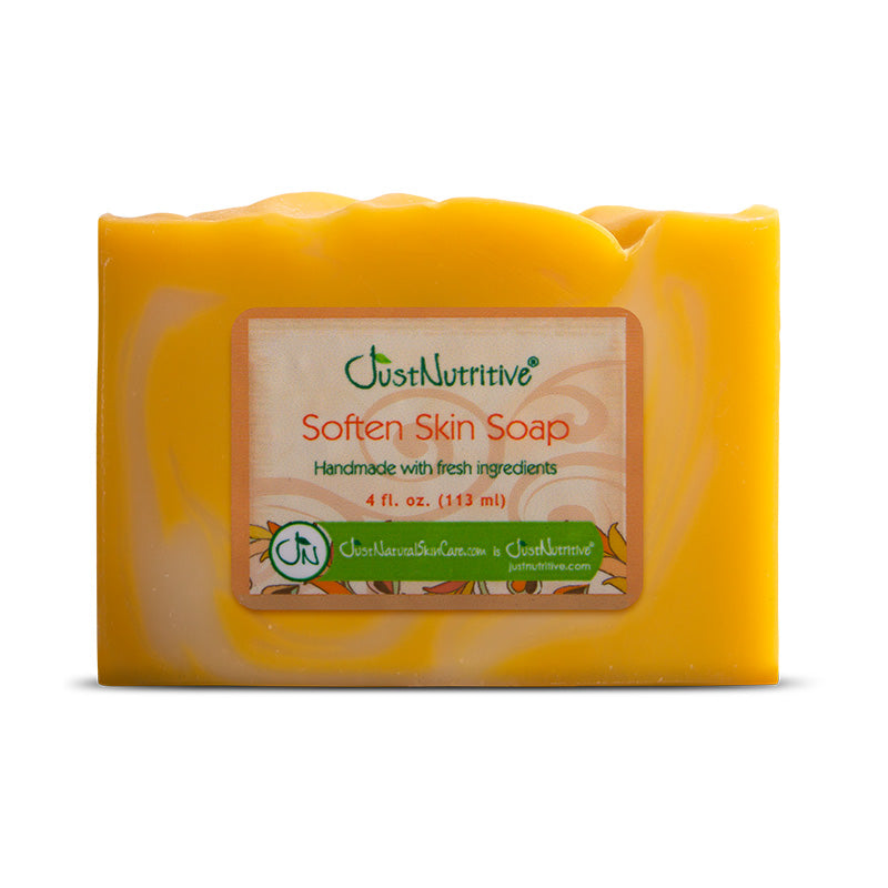 Yellow bar of soap with a label on a white background