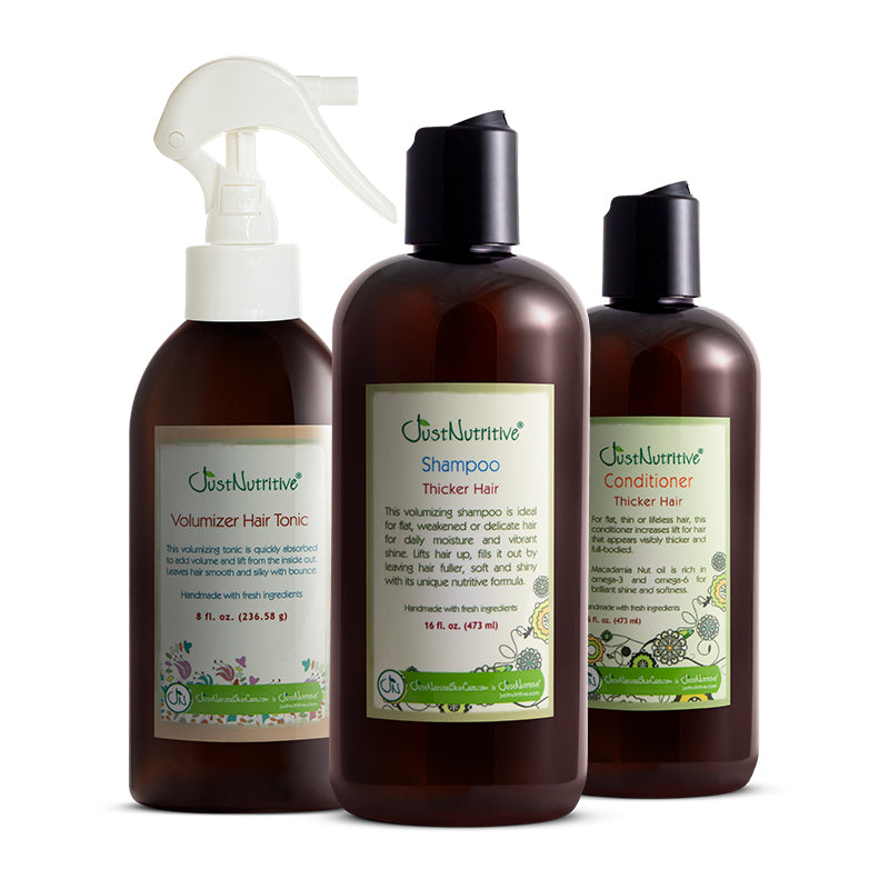Three brown hair care products with labels on a white background